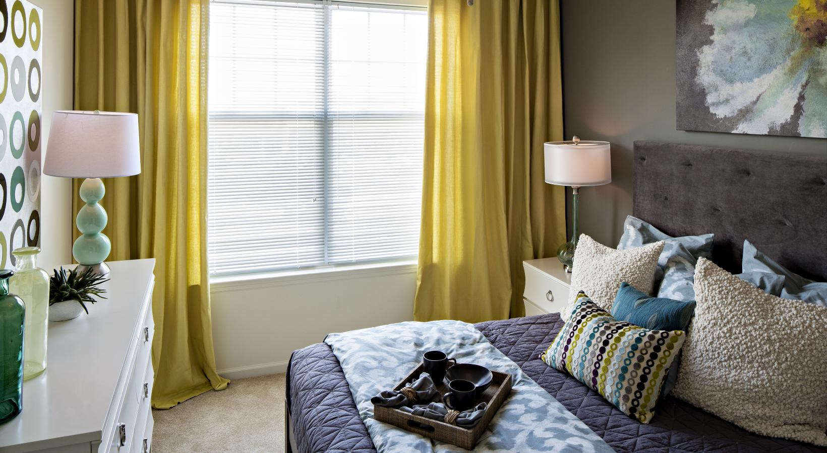 Bedroom options to fit every lifestyle a bedroom with a bed and lamps