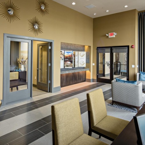 a large living room with a large glass door