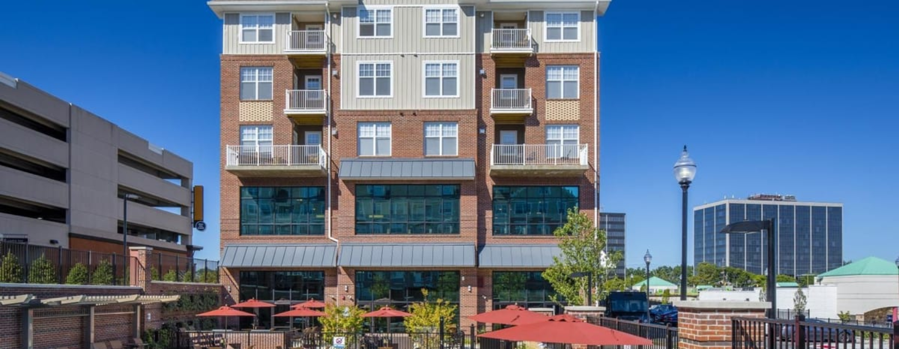 Reimagining Luxury Living | the front of a building with several windows