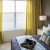 a bedroom with a bed and lamps