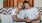 two men sitting on a couch