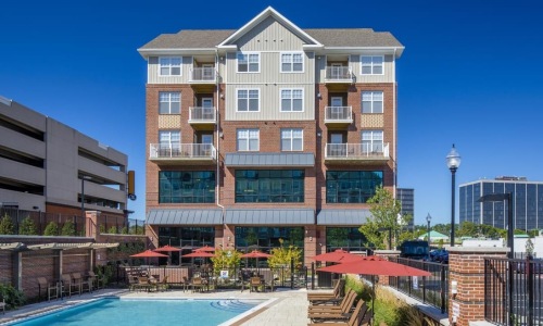 Reimagining Luxury Living | Love where you live Reimagining Luxury Living | the front of a building with several windows